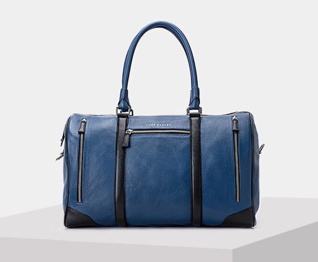 Compact yet functional bags are easier for the season, so they stay close to the body and don’t get wet in a downpour. (Single zip closure, light grain, multi pocket light grain leather duffle bag by Tiger Marron) Compact yet functional bags are easier for the season, so they stay close to the body and don’t get wet in a downpour. (Single zip closure, light grain, multi pocket light grain leather duffle bag by Tiger Marron)