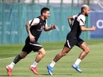 Paris St Germain's Lionel Messi and Neymar during training.