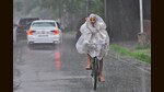 A cyclist caught in the downpour in Sector 33, Chandigarh, on Sunday morning. (Keshav Singh/HT)