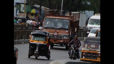 Heavy vehicles seen plying on Pune - Satara road near Market Yard chowk on Sunday. (Ravindra Joshi/HT PHOTO)