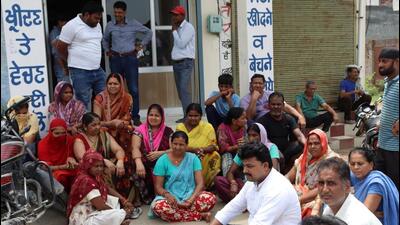 Residents outside the office Aam Aadmi Party (AAP) MLA from Ludhiana South constituency Rajinder Kaur Chhina on Sunday. (HT Photo)
