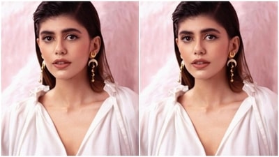 Sanjana decked up in a white top with dramatic full sleeves and a plunging neckline, she teamed it with a white high-waisted pencil skirt featuring a white lace. (Instagram/@sanjanasanghi96)