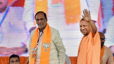 Uttar Pradesh chief minister Yogi Adityanath waves to supporters at a public meeting held by the BJP in Hyderabad. (PTI Photo) Uttar Pradesh chief minister Yogi Adityanath waves to supporters at a public meeting held by the BJP in Hyderabad. (PTI Photo)