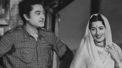 Kishore Kumar and Madhubala in a still from Jhumroo. Kishore Kumar and Madhubala in a still from Jhumroo. 