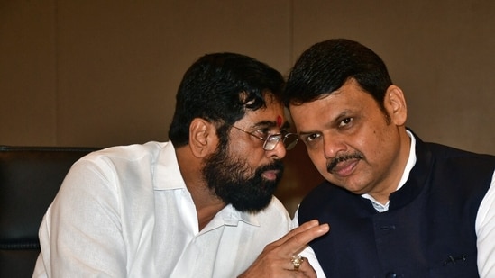 Mumbai, July 02 (ANI): Maharashtra Chief Minister (CM) Eknath Shinde interacts with state Deputy CM Devendra Fadnavis at the first joint meeting with BJP and Shiv Sena (Shinde faction) MLAs before the Special Session of Maharashtra Assembly, at Taj Hotel, in Mumbai on Saturday. (ANI Photo)(Deepak Salvi)
