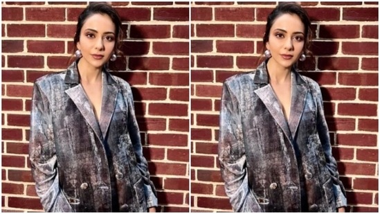 Rakul Preet decked up in a grey bra and layered it with a grey blazer with translucent details, the blazer featured lapel collars and buttons. She completed her look for the day in matching grey trousers.(Instagram/@rakulpreet)