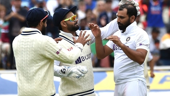 India's Mohammed Shami, right, celebrates with teammates after dismissing England's Jonny Bairstow during the third day of the fifth Test(AP)