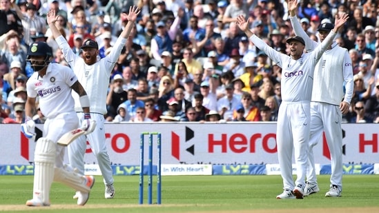 Unsuccessful appeal by England's Joe Root, right, and England's Jonny Bairstow for the wicket of India's Virat Kohli during the third day of the fifth Test(AP)