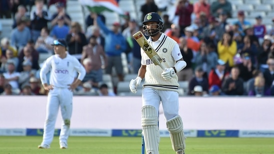 India's Cheteshwar Pujara celebrates after reaching half century during the third day of the fifth Test(AP)