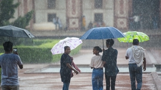 Visitors at Humayun's Tomb during a brief spell of Rains in New Delhi, on July 3, 2022.&nbsp;(Sanchit Khanna/HT Photo)