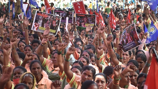 Bengaluru: Pourakarmikas (safai karamchari) shout slogans during their statewide indefinite strike demanding regularization of their services, dignified working conditions, post-retirement benefits and other welfare measures, at Freedom Park in Bengaluru, Friday, July 1, 2022.(PTI)