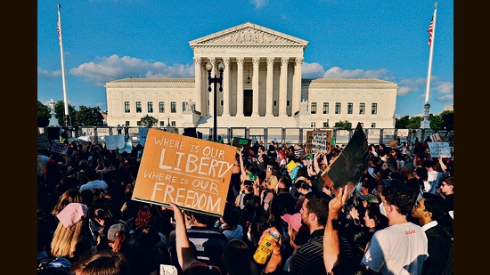Demonstrators protest outside the US Supreme Court. (REUTERS)
