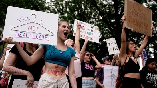 People rally in support of abortion rights Saturday, July 2, 2022, in Kansas City, Mo. (AP Photo/Charlie Riedel)