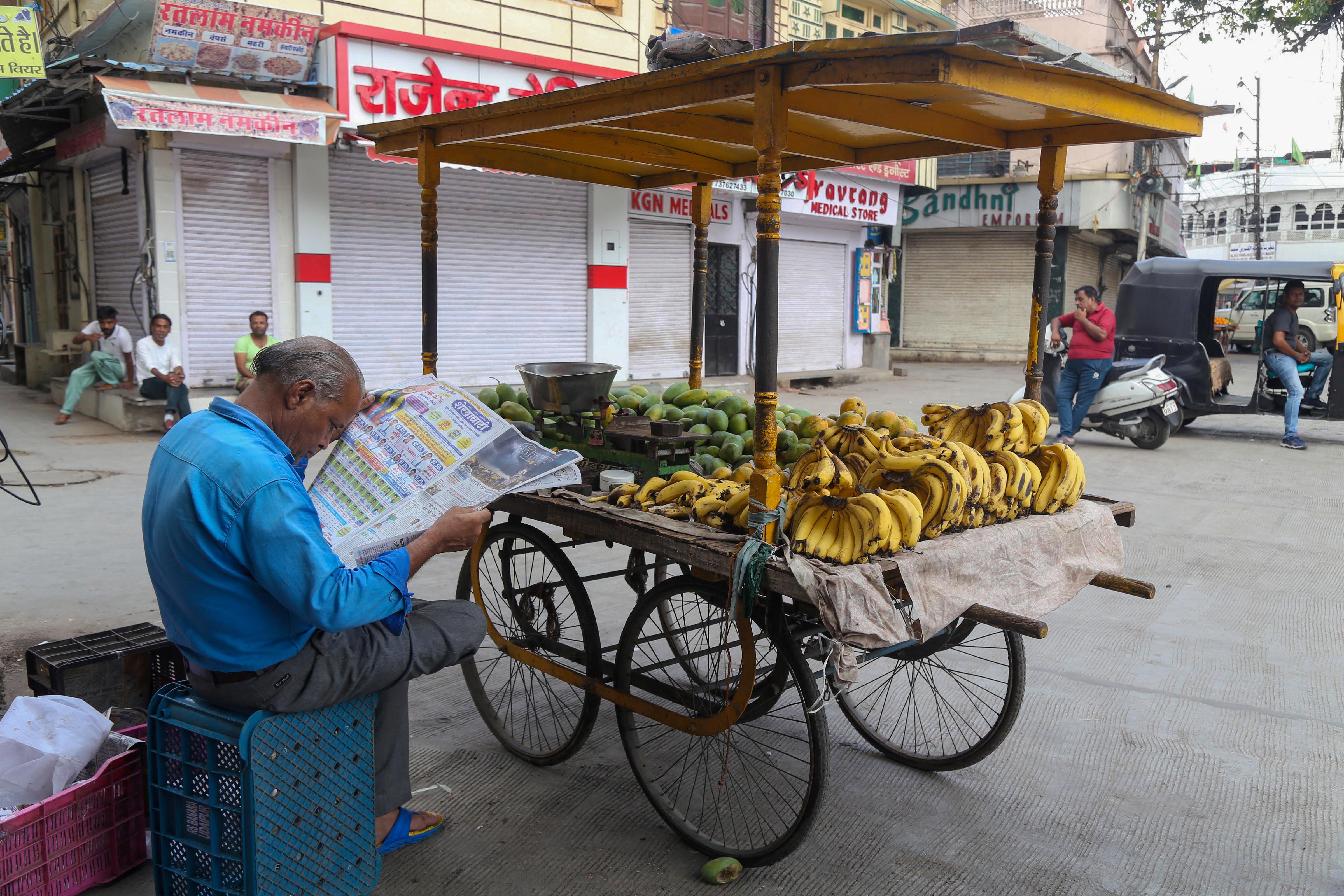 A fruit vendor waits for customers during a ten-hour relaxation in the curfew imposed by administration to maintain law and order after the murder of Kanhaiya Lal, in Udaipur, on July 3, 2022. (PTI) A fruit vendor waits for customers during a ten-hour relaxation in the curfew imposed by administration to maintain law and order after the murder of Kanhaiya Lal, in Udaipur, on July 3, 2022. (PTI)