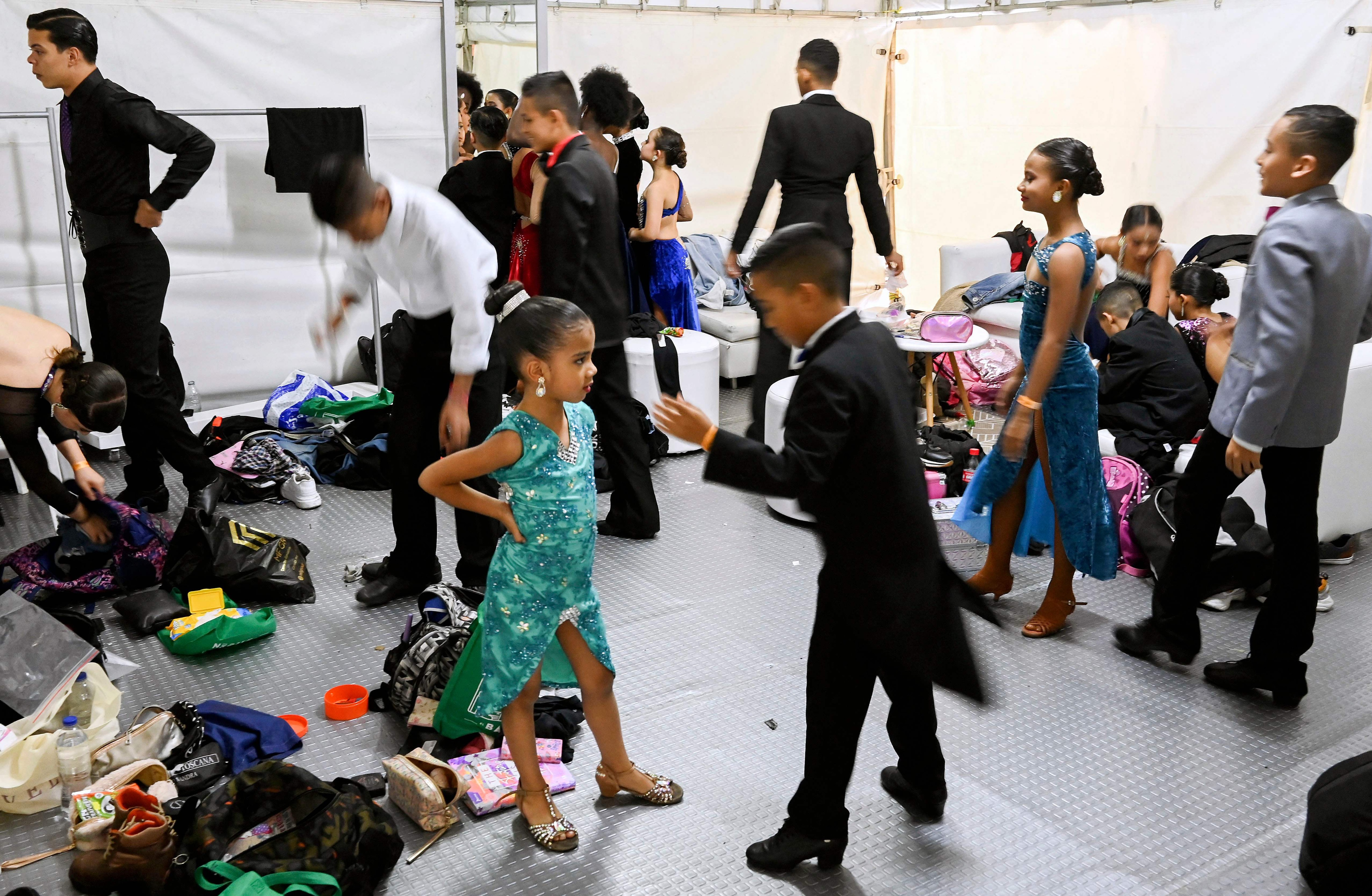 Tango dancers wait backstage for their turn, during the closing event of the Medellin Tango Festival in Medellin, on June 26, 2022. (Photo by JOAQUIN SARMIENTO / AFP) (AFP) Tango dancers wait backstage for their turn, during the closing event of the Medellin Tango Festival in Medellin, on June 26, 2022. (Photo by JOAQUIN SARMIENTO / AFP) (AFP)
