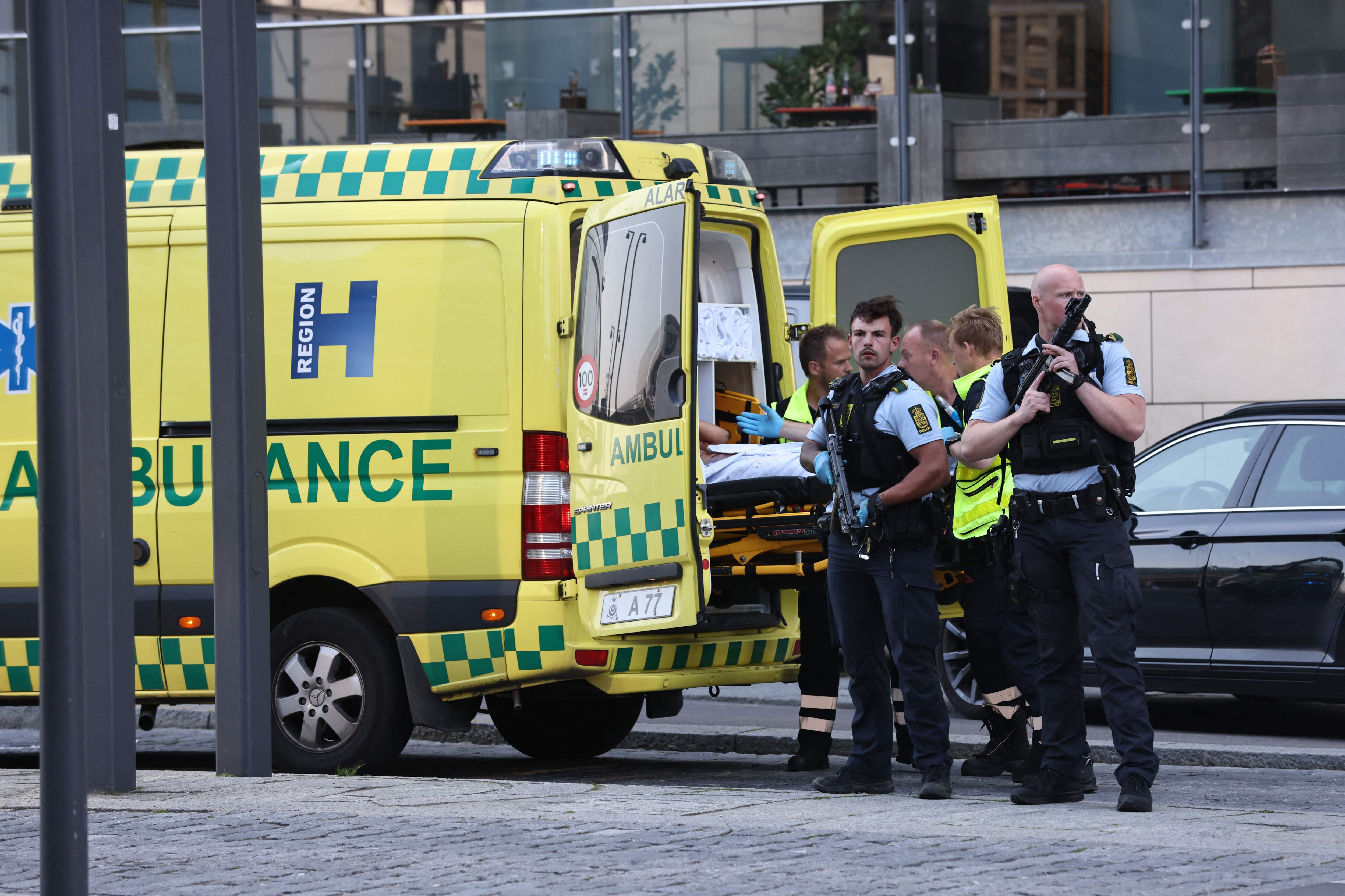 An ambulance and armed police are seen during the evacuation of people at the Fields shopping center in Copenhagen, Denmark, on July 3, 2022 after Danish media reported a shooting. (Photo by Olafur Steinar Gestsson/Ritzau Scanpix/AFP) An ambulance and armed police are seen during the evacuation of people at the Fields shopping center in Copenhagen, Denmark, on July 3, 2022 after Danish media reported a shooting. (Photo by Olafur Steinar Gestsson/Ritzau Scanpix/AFP)