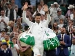 Novak Djokovic waves after defeating Tim van Rijthoven in a men's fourth round singles match on day seven of the Wimbledon tennis championships. Novak Djokovic waves after defeating Tim van Rijthoven in a men's fourth round singles match on day seven of the Wimbledon tennis championships.