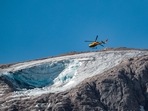 The peak was too unstable for rescuers to try to approach on foot, Comelli said, adding that recent hot weather had been a factor in the collapse.