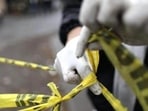 A forensic technician ties a used police line together to seal off a crime scene in Monterrey. (Reuters Photo/Representative Image) A forensic technician ties a used police line together to seal off a crime scene in Monterrey. (Reuters Photo/Representative Image)