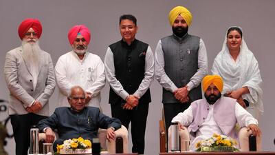Punjab governor Banwarilal Purohit and chief minister Bhagwant Mann along with (standing, L-R) new cabinet ministers Inderbir Singh Nijjar, Chetan Singh Jouramajra, Aman Arora, Fauja Singh Sarari and Anmol Gagan Mann after the oath ceremony at the Raj Bhawan in Chandigarh on Monday. (Ravi Kumar/HT) Punjab governor Banwarilal Purohit and chief minister Bhagwant Mann along with (standing, L-R) new cabinet ministers Inderbir Singh Nijjar, Chetan Singh Jouramajra, Aman Arora, Fauja Singh Sarari and Anmol Gagan Mann after the oath ceremony at the Raj Bhawan in Chandigarh on Monday. (Ravi Kumar/HT)