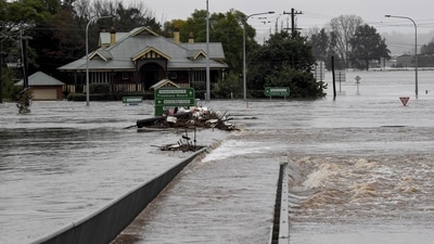 Debris is seen as the Windsor Bridge is submerged under floodwater from the swollen Hawkesbury River in Windsor, north west of Sydney, Australia. (via REUTERS)