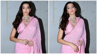 Sarees are a must-have silhouette in every fashion enthusiast's wardrobe. This evergreen ensemble can help you create dynamic and swoon-worthy looks. And no one understands this better than Nora Fatehi. The dancer-turned-actor is currently a judge on the reality show Dance Deewane Juniors. She often makes appearances on the sets dressed in beauteous six yards, and today is no different. (HT Photo/Varinder Chawla) Sarees are a must-have silhouette in every fashion enthusiast's wardrobe. This evergreen ensemble can help you create dynamic and swoon-worthy looks. And no one understands this better than Nora Fatehi. The dancer-turned-actor is currently a judge on the reality show Dance Deewane Juniors. She often makes appearances on the sets dressed in beauteous six yards, and today is no different. (HT Photo/Varinder Chawla)