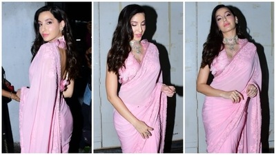 On Monday, paparazzi clicked Nora arriving on the Dance Deewane Juniors sets. They spotted the star outside the venue, dressed in a blush pink embroidered saree and a stylish blouse, serving fans a sartorial win of the day with her bespoke ensemble. Her pictures will definitely sweep you off your feet. Scroll ahead to take a look. (HT Photo/Varinder Chawla) On Monday, paparazzi clicked Nora arriving on the Dance Deewane Juniors sets. They spotted the star outside the venue, dressed in a blush pink embroidered saree and a stylish blouse, serving fans a sartorial win of the day with her bespoke ensemble. Her pictures will definitely sweep you off your feet. Scroll ahead to take a look. (HT Photo/Varinder Chawla)