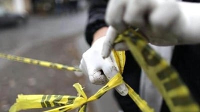 A forensic technician ties a used police line together to seal off a crime scene in Monterrey.&nbsp; (Reuters Photo/Representative Image)