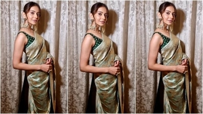 In the end, Rakul chose a centre-parted sleek bun with a few strands sculpting her face, dewy base, blushed cheeks, beaming highlighter, nude lip shade, mascara on the lashes, and subtle eye shadow for the glam picks. (Instagram) In the end, Rakul chose a centre-parted sleek bun with a few strands sculpting her face, dewy base, blushed cheeks, beaming highlighter, nude lip shade, mascara on the lashes, and subtle eye shadow for the glam picks. (Instagram)