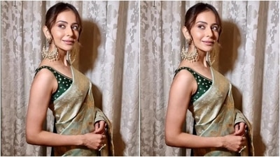 Rakul glammed up her getup with minimal jewels that elevated the chic elegance of her six yards. She chose heavy statement gold earrings, a golden clutch, ornate gold rings and matching stilettos with high heels. (Instagram) Rakul glammed up her getup with minimal jewels that elevated the chic elegance of her six yards. She chose heavy statement gold earrings, a golden clutch, ornate gold rings and matching stilettos with high heels. (Instagram)