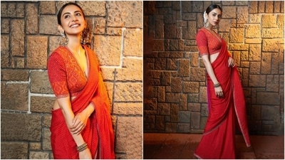 Rakul chose oxidised silver hoop earrings, chunky bracelets, strappy embellished heels, a centre-parted sleek bun decorated with a gajra, mascara on the lashes, kohl-lined eyes, nude lip shade, and blushed cheeks to glam up the traditional look. (Instagram) Rakul chose oxidised silver hoop earrings, chunky bracelets, strappy embellished heels, a centre-parted sleek bun decorated with a gajra, mascara on the lashes, kohl-lined eyes, nude lip shade, and blushed cheeks to glam up the traditional look. (Instagram)