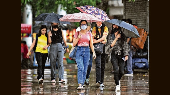 Grab chic sandals at Sarojini or head to INA market for some super cool cartoon-themed raincoats. Rainbow-inspired umbrellas, are also a big hit in Lajpat Nagar market. (Photo: Shrikant Singh/ANI)