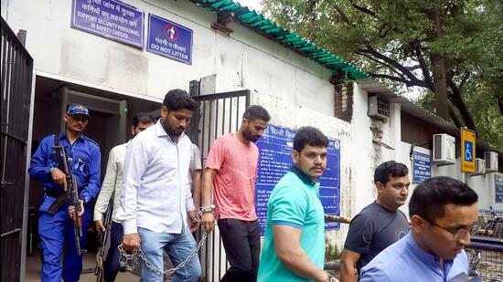 Deepak (in green) and Keshav (in pink), gang members of Lawrence Bishnoi, leave after being produced before Patiala Court in connection with the Sidhu Moosewala murder case, in New Delhi on Monday. (ANI) Deepak (in green) and Keshav (in pink), gang members of Lawrence Bishnoi, leave after being produced before Patiala Court in connection with the Sidhu Moosewala murder case, in New Delhi on Monday. (ANI)