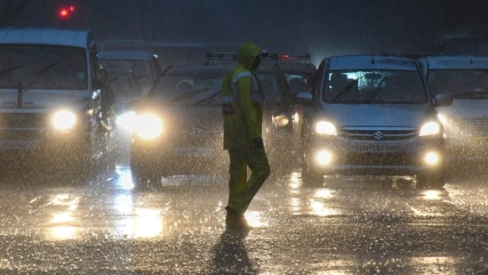 Vehicles ply on a road amid monsoon rains, in Mumbai on Monday.(PTI) Vehicles ply on a road amid monsoon rains, in Mumbai on Monday.(PTI)