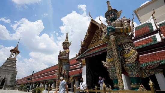 Tourists visit Grand Palace in Bangkok, Thailand. Summer travel is underway across the globe but a full recovery from two years of coronavirus could last as long as the pandemic itself. &nbsp;(AP Photo/Sakchai Lalit)