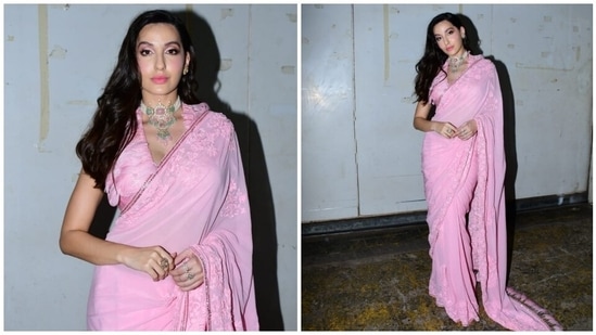 In the end, Nora chose side-parted open tresses styled in soft curls, shimmery baby pink eye shadow, sleek black eyeliner, kohl-lined eyes, pink lip shade, dewy base, blushed cheeks, beaming highlighter, and mascara on the lashes for the glam picks.(HT Photo/Varinder Chawla)