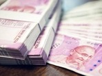 Indian Rupee money stacks and banknotes on the table , closed up shot (Shutterstock) Indian Rupee money stacks and banknotes on the table , closed up shot (Shutterstock)