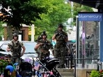 Law enforcement search after a mass shooting at the Highland Park Fourth of July parade in downtown Highland Park, Ill., Monday, July 4, 2022. A gunman on a rooftop opened fire on an Independence Day parade in suburban Chicago on Monday. (AP Photo/Nam Y. Huh)