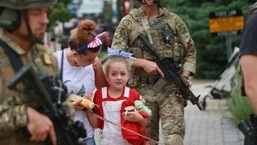 Law enforcement escorts a family away from the scene of a shooting at a Fourth of July parade on July 4, 2022 in Highland Park, Illinois, Chicago, in the United States. Mark Borenstein/Getty Images/AFP