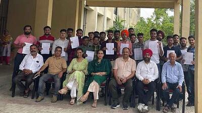 Students who got jobs in textile industries in Ludhiana with their appointment letters. (HT PHOTO)