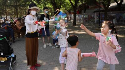 Children play with bubbles at a park during Dragon Boat festival holiday in Beijing, China on June 4, 2022. (REUTERS) Children play with bubbles at a park during Dragon Boat festival holiday in Beijing, China on June 4, 2022. (REUTERS)