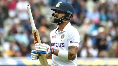 Virat Kohli reacts as he walks off the field after losing his wicket to Ben Stokes (AP)