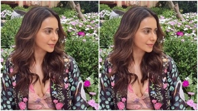 In pink earrings from the house of Karishma Joolry and tresses open and styled in wavy curls by stylist Anshika Verma, Rakul Preet posed for the outdoor photoshoot. (Instagram/@rakulpreet)