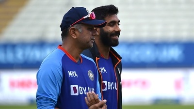 India's Jasprit Bumrah, right, and coach Rahul Dravid (AP) India's Jasprit Bumrah, right, and coach Rahul Dravid (AP)