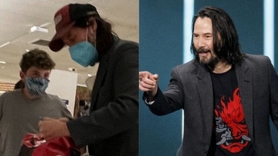 Keanu Reeves with a fan at the New York airport. Keanu Reeves with a fan at the New York airport.