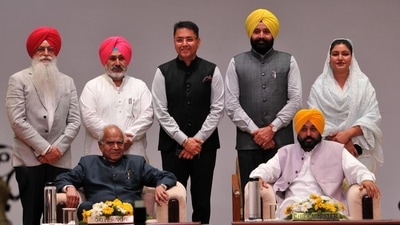 Punjab governor Banwarilal Purohit and chief minister Bhagwant Mann along with (standing, L-R) new cabinet ministers Inderbir Singh Nijjar, Chetan Singh Jouramajra, Aman Arora, Fauja Singh Sarari and Anmol Gagan Mann after the oath ceremony at the Raj Bhawan in Chandigarh on Monday. (Ravi Kumar/HT Photo) Punjab governor Banwarilal Purohit and chief minister Bhagwant Mann along with (standing, L-R) new cabinet ministers Inderbir Singh Nijjar, Chetan Singh Jouramajra, Aman Arora, Fauja Singh Sarari and Anmol Gagan Mann after the oath ceremony at the Raj Bhawan in Chandigarh on Monday. (Ravi Kumar/HT Photo)