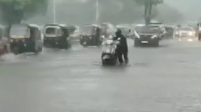 A man is forced to push his scooty manually through a waterlogged street. (ANI) 