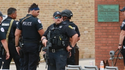 “There’s no safe place,” said Highland Park resident Barbara Harte, 73, who had stayed away from the parade fearing a mass shooting, but later ventured from her home. (AFP)