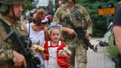 Law enforcement escorts a family away from the scene of a shooting at a Fourth of July parade on July 4, 2022 in Highland Park, Illinois, Chicago, in the United States. Mark Borenstein/Getty Images/AFP (AFP) Law enforcement escorts a family away from the scene of a shooting at a Fourth of July parade on July 4, 2022 in Highland Park, Illinois, Chicago, in the United States. Mark Borenstein/Getty Images/AFP (AFP)