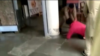 The man had been called by the police over a domestic violence complaint when he lost his temper and began delivering blows to the cop. (ANI videograb) The man had been called by the police over a domestic violence complaint when he lost his temper and began delivering blows to the cop. (ANI videograb)